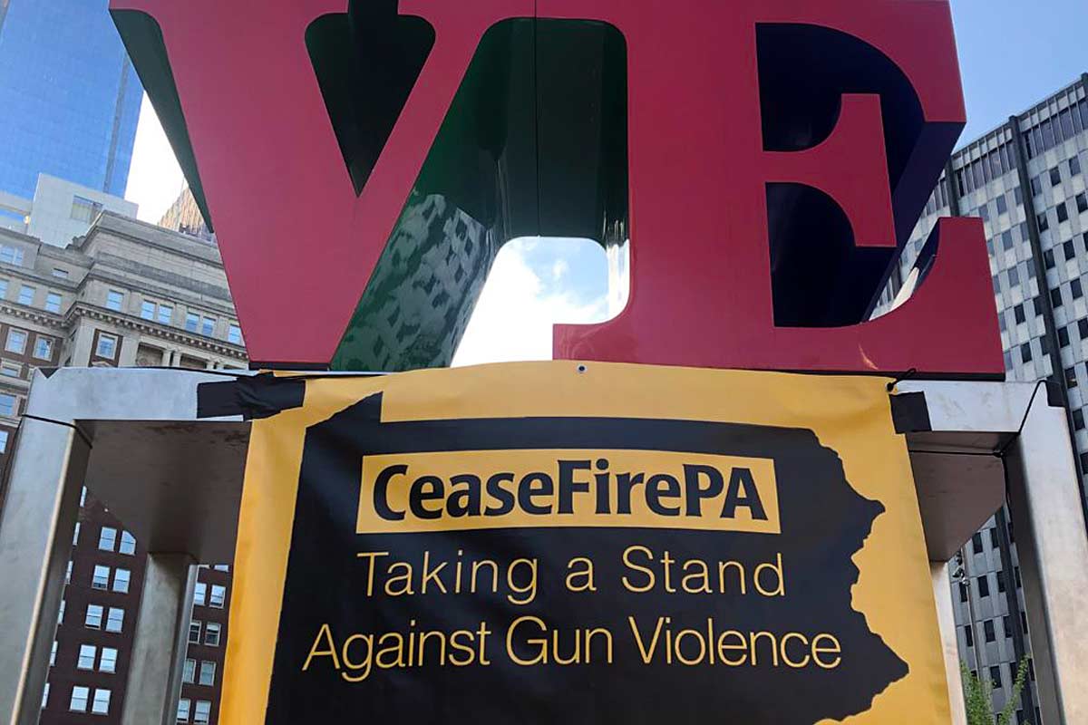 CeaseFire PA banner below Philadelphia LOVE sculpture