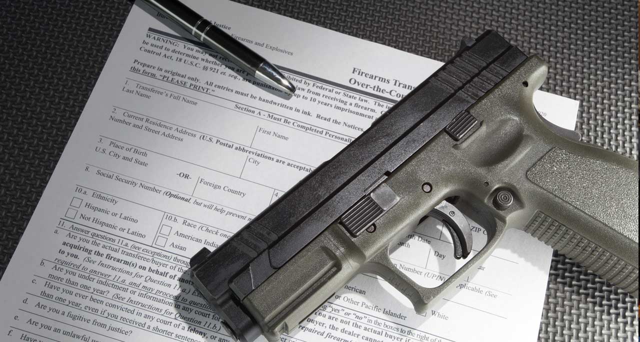 gun and paperwork